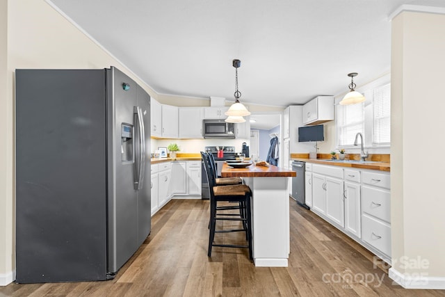 117 Pine Bluff Dr, Mooresville, NC 28117 - kitchen featuring white cabinetry, wooden counters, stainless steel appliances, and a sink