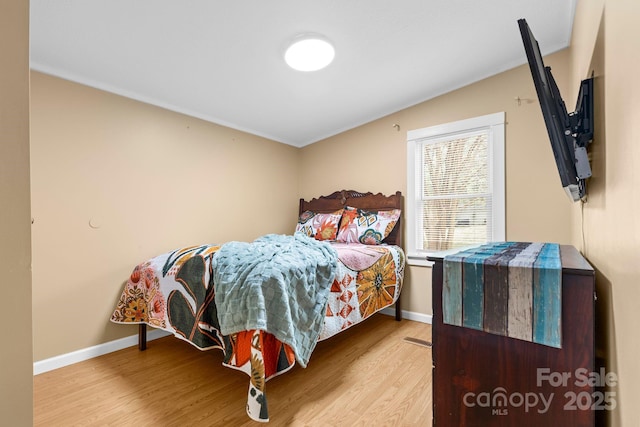 117 Pine Bluff Dr, Mooresville, NC 28117 - bedroom with baseboards and wood finished floors