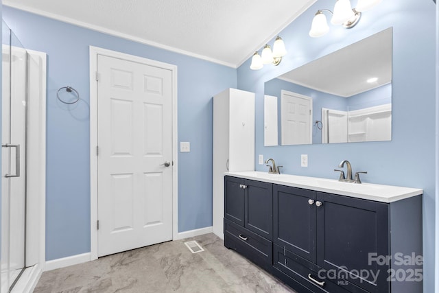 117 Pine Bluff Dr, Mooresville, NC 28117 - bathroom with a shower stall, double vanity, visible vents, and a sink
