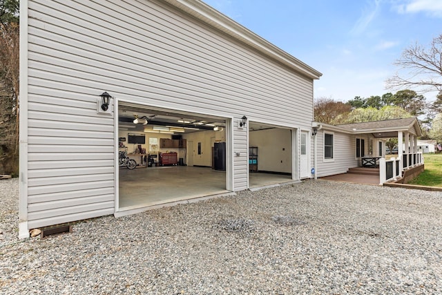 117 Pine Bluff Dr, Mooresville, NC 28117 - view of side of home with a garage, water heater, and driveway