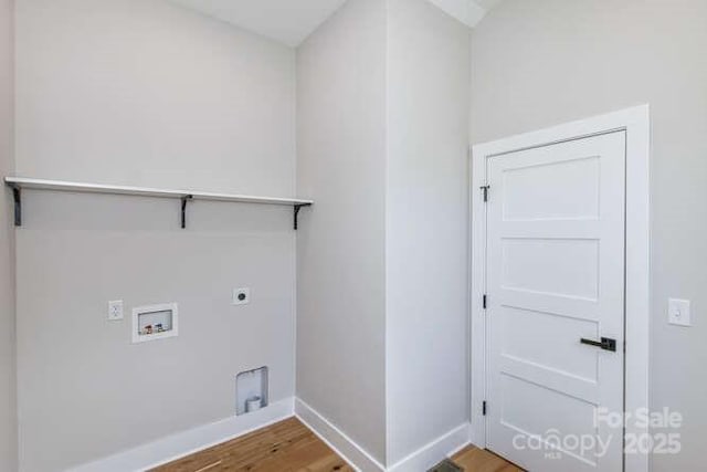 washroom featuring laundry area, wood finished floors, baseboards, washer hookup, and hookup for an electric dryer