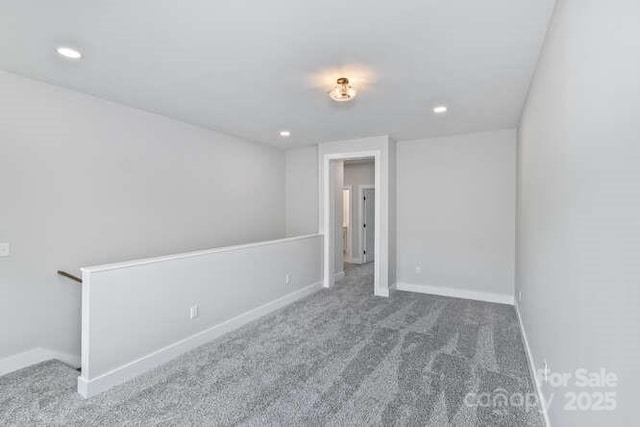 unfurnished bedroom with carpet floors, baseboards, and recessed lighting