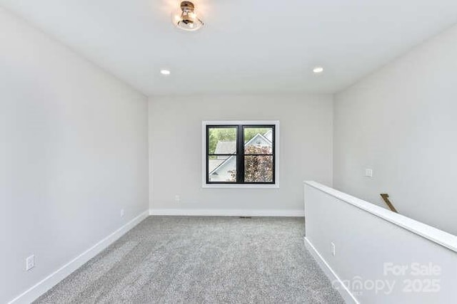 unfurnished room featuring carpet floors, recessed lighting, and baseboards
