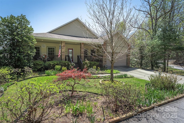 172 Sunny Ridge Rd, Hendersonville, NC 28739 - view of front of home with concrete driveway, a garage, a shingled roof, and covered porch
