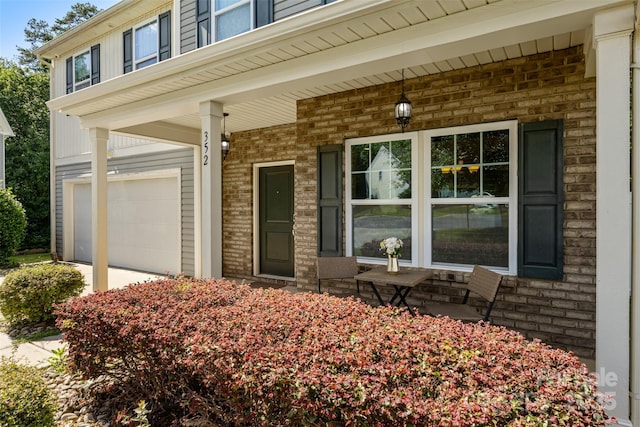 352 Nantucket Way, Rock Hill, SC 29732 - view of exterior entry featuring an attached garage, covered porch, and brick siding