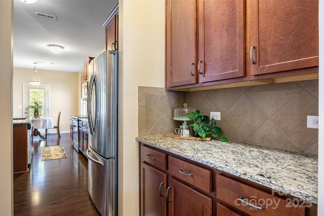 352 Nantucket Way, Rock Hill, SC 29732 - kitchen with freestanding refrigerator, decorative backsplash, dark wood-style flooring, and light stone countertops