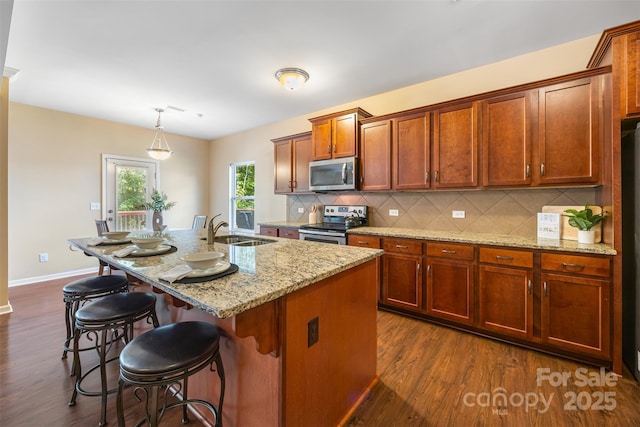 352 Nantucket Way, Rock Hill, SC 29732 - kitchen with appliances with stainless steel finishes, dark wood finished floors, backsplash, and light stone counters