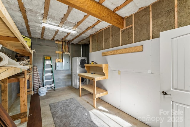 1600 Pisgah Preserve Dr, Nebo, NC 28761 - unfinished basement with concrete block wall, stacked washing maching and dryer, and electric panel