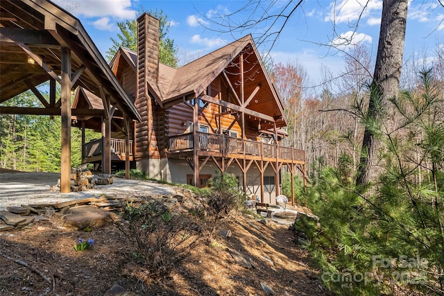 1600 Pisgah Preserve Dr, Nebo, NC 28761 - back of property with a chimney, a shingled roof, a deck, and log exterior