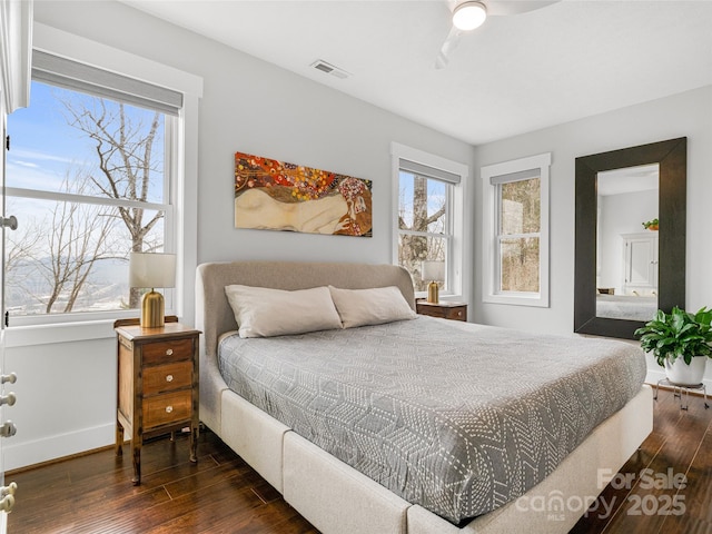 322 Windswept Dr, Asheville, NC 28801 - bedroom featuring visible vents, multiple windows, and hardwood / wood-style floors