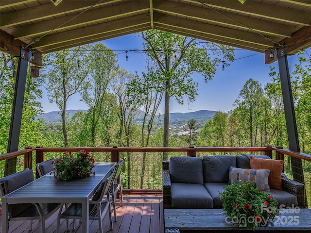322 Windswept Dr, Asheville, NC 28801 - wooden terrace featuring outdoor dining area, a mountain view, and an outdoor hangout area