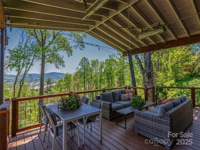 322 Windswept Dr, Asheville, NC 28801 - wooden terrace with outdoor dining space, an outdoor living space, and a mountain view