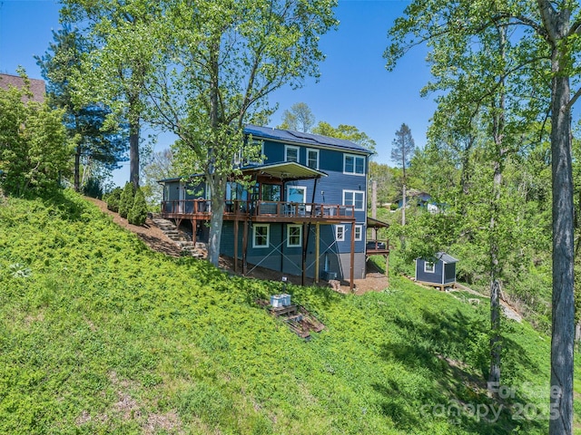 322 Windswept Dr, Asheville, NC 28801 - back of house featuring stairway, a wooden deck, an outbuilding, and a shed