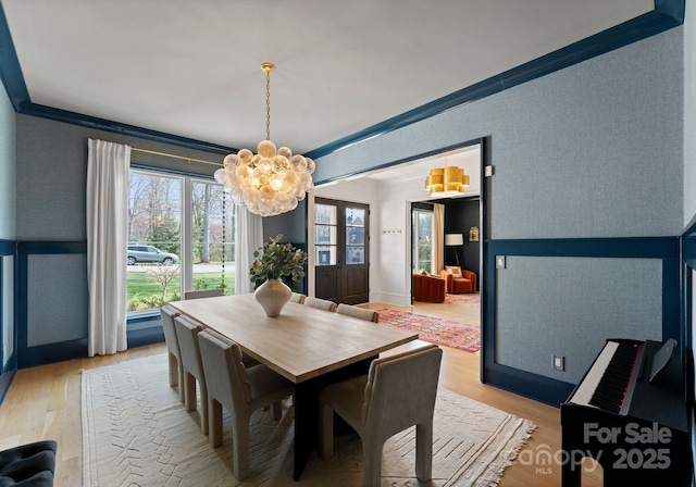300 Mammoth Oaks Dr, Charlotte, NC 28270 - dining space with a chandelier, light wood-style floors, and crown molding