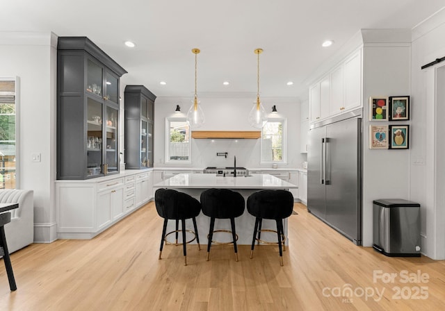 300 Mammoth Oaks Dr, Charlotte, NC 28270 - kitchen with built in fridge, light countertops, light wood-type flooring, healthy amount of natural light, and recessed lighting
