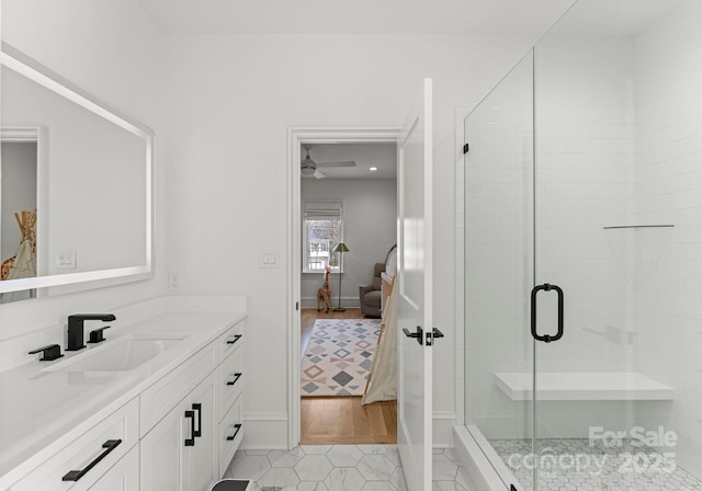 300 Mammoth Oaks Dr, Charlotte, NC 28270 - ensuite bathroom featuring vanity, a shower stall, baseboards, ceiling fan, and tile patterned floors