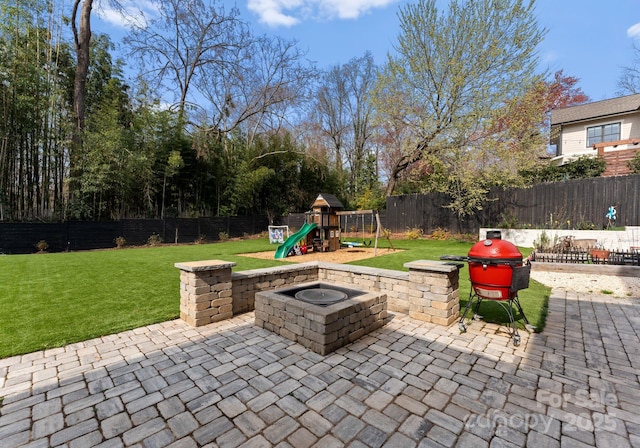 300 Mammoth Oaks Dr, Charlotte, NC 28270 - view of patio / terrace with a playground, a fire pit, and a grill