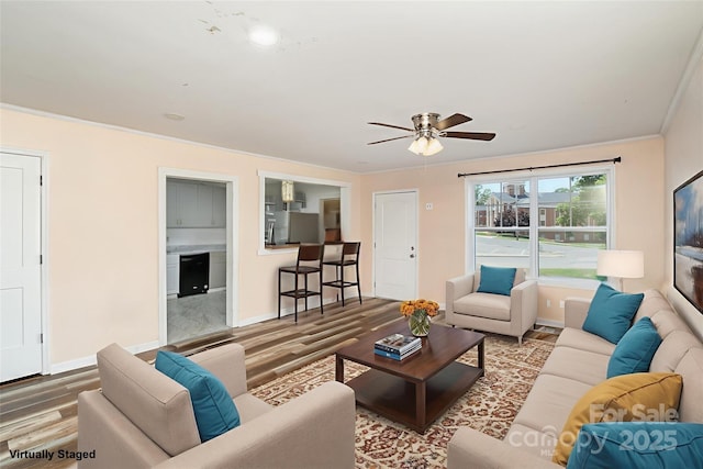 400 E 1st St, Cherryville, NC 28021 - living area with wood finished floors, baseboards, and crown molding