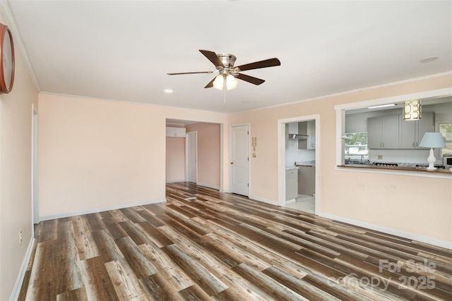 400 E 1st St, Cherryville, NC 28021 - unfurnished living room featuring dark wood-style flooring, ceiling fan, and baseboards