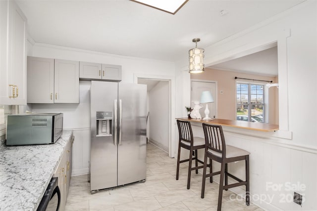 400 E 1st St, Cherryville, NC 28021 - kitchen with stainless steel fridge with ice dispenser, light countertops, gray cabinets, hanging light fixtures, and ornamental molding