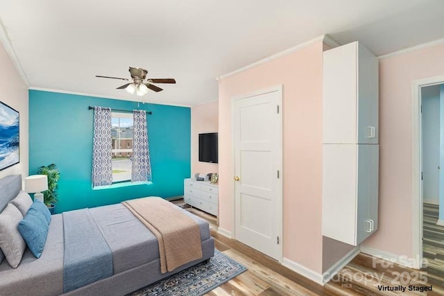400 E 1st St, Cherryville, NC 28021 - bedroom with ornamental molding, light wood finished floors, a ceiling fan, and baseboards