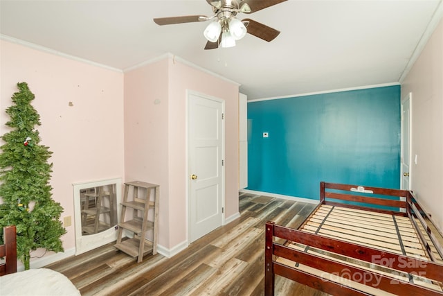 400 E 1st St, Cherryville, NC 28021 - bedroom with wood finished floors, ornamental molding, ceiling fan, and baseboards