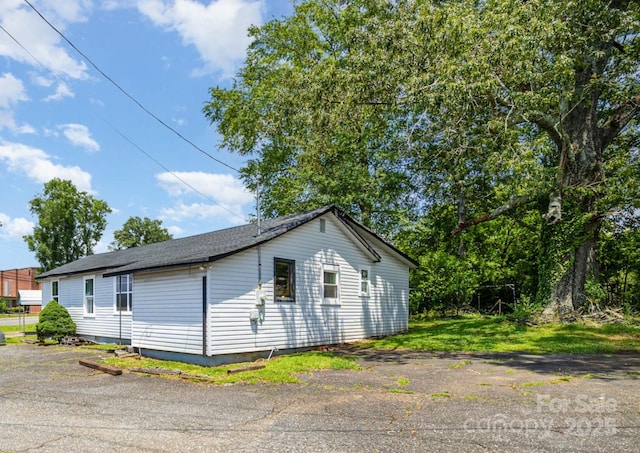 400 E 1st St, Cherryville, NC 28021 - view of side of property with a shingled roof
