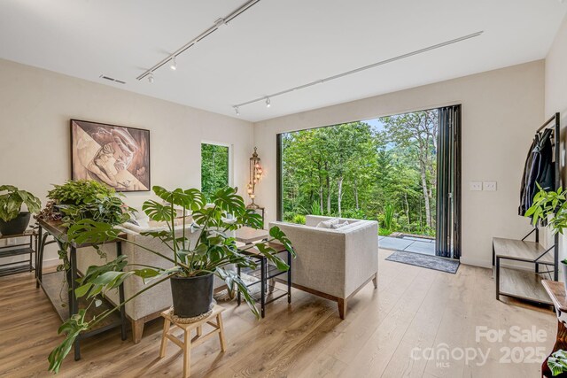47 Webb Cove Rd, Asheville, NC 28804 - sitting room with visible vents, rail lighting, and wood finished floors