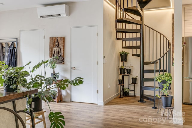 47 Webb Cove Rd, Asheville, NC 28804 - stairs featuring wood finished floors, baseboards, and a wall mounted AC