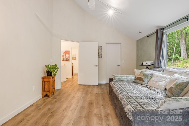47 Webb Cove Rd, Asheville, NC 28804 - bedroom featuring visible vents, light wood-style flooring, high vaulted ceiling, and baseboards