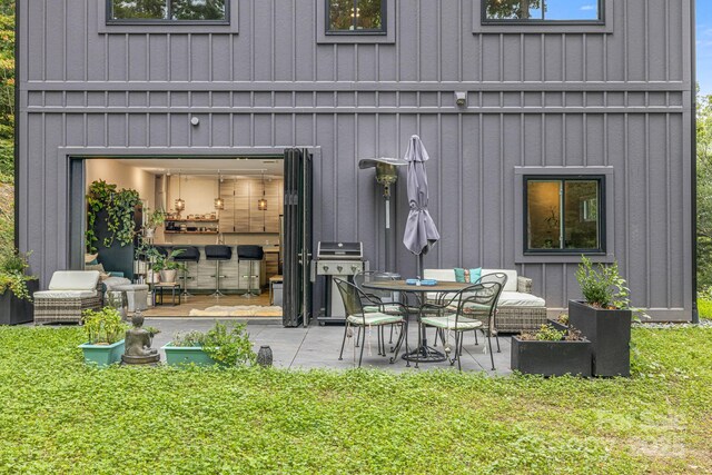 47 Webb Cove Rd, Asheville, NC 28804 - rear view of house with a patio area and board and batten siding