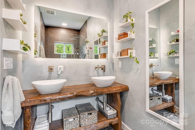 47 Webb Cove Rd, Asheville, NC 28804 - bathroom with a walk in shower, visible vents, and a sink