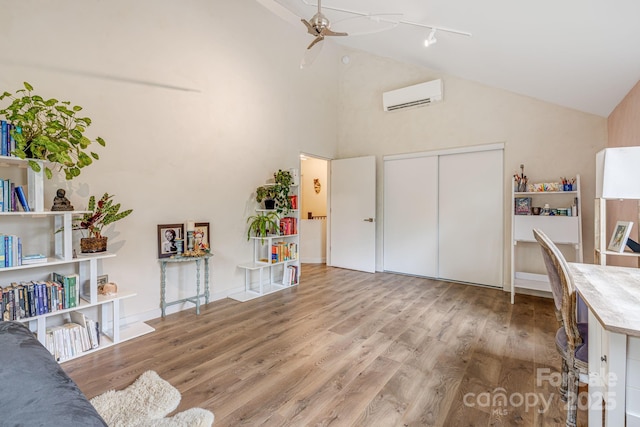 47 Webb Cove Rd, Asheville, NC 28804 - office space featuring high vaulted ceiling, a ceiling fan, a wall mounted AC, wood finished floors, and baseboards