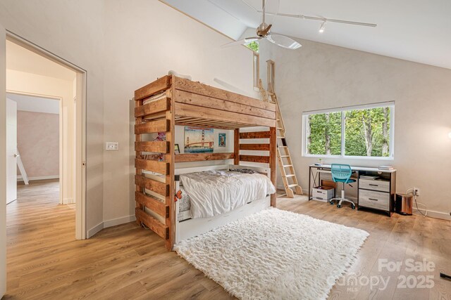 47 Webb Cove Rd, Asheville, NC 28804 - bedroom featuring ceiling fan, high vaulted ceiling, baseboards, and wood finished floors