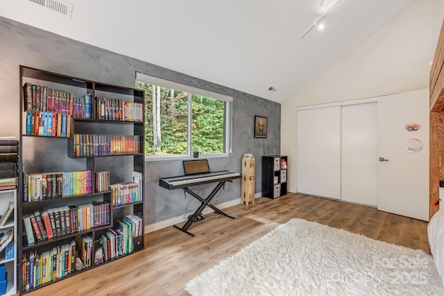 47 Webb Cove Rd, Asheville, NC 28804 - interior space with vaulted ceiling, wood finished floors, and visible vents