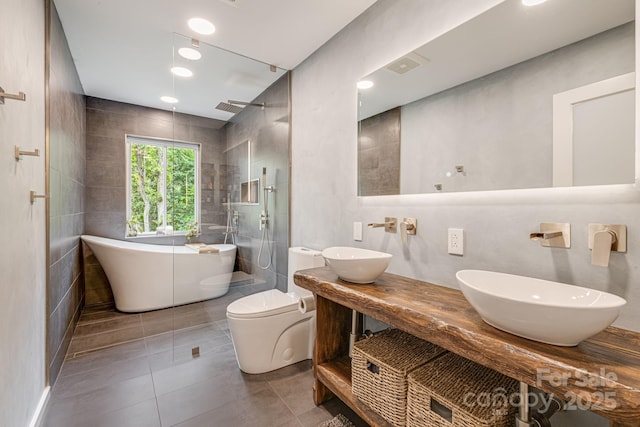 47 Webb Cove Rd, Asheville, NC 28804 - bathroom featuring a sink, tile walls, and a walk in shower
