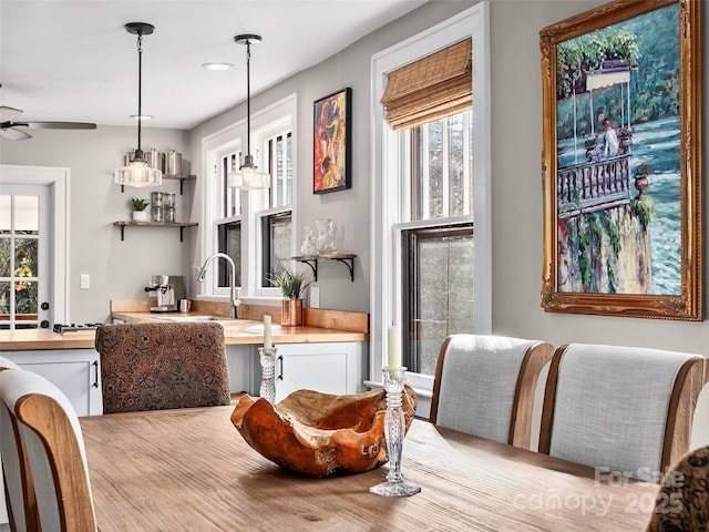 dining area featuring a ceiling fan