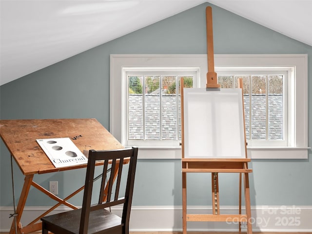 dining room featuring vaulted ceiling