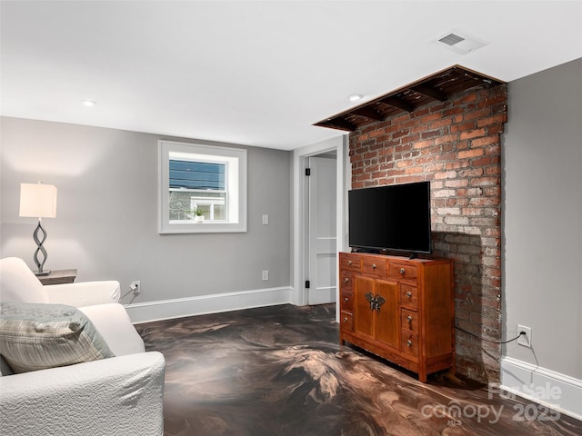 living room with visible vents and baseboards