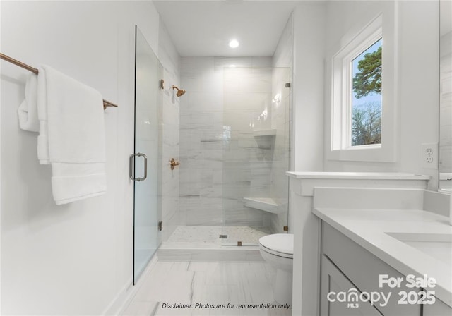 bathroom with toilet, marble look tile flooring, a shower stall, vanity, and recessed lighting