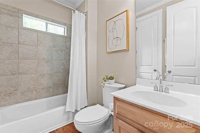 bathroom with shower / tub combo, toilet, crown molding, and vanity