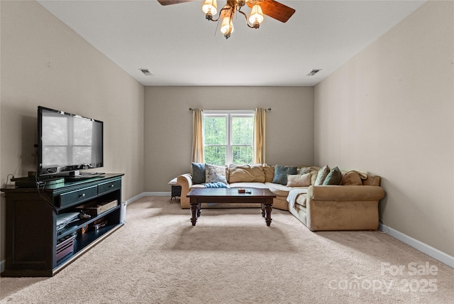 carpeted living area with baseboards, a ceiling fan, and visible vents