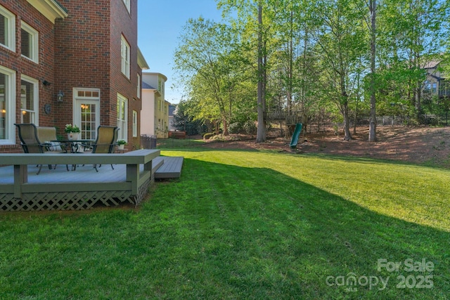 view of yard with a wooden deck