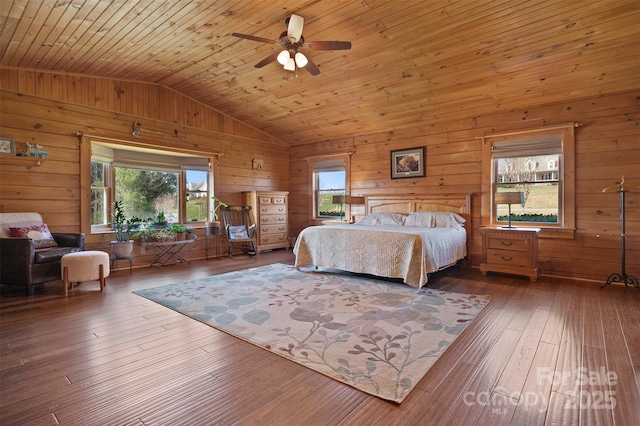bedroom with lofted ceiling, wooden walls, wood ceiling, and hardwood / wood-style flooring