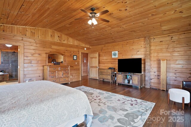 bedroom with lofted ceiling, wooden walls, wooden ceiling, and hardwood / wood-style flooring
