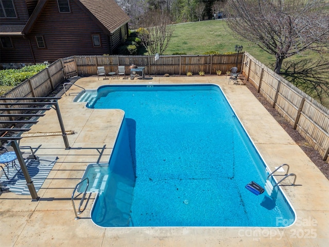 view of swimming pool featuring a patio, a fenced in pool, a fenced backyard, outdoor lounge area, and a lawn