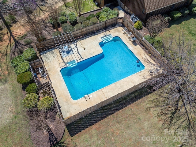 pool featuring a patio area and fence