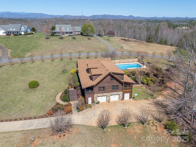 birds eye view of property featuring a rural view and a mountain view