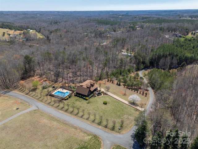 aerial view with a wooded view