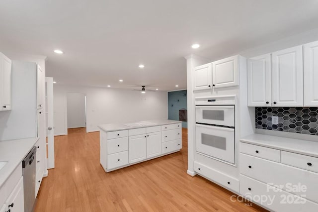 2750 Morgan Rd, Gold Hill, NC 28071 - kitchen with double oven, dishwasher, light countertops, light wood-style flooring, and a ceiling fan